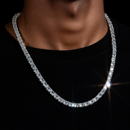 Emerald cut white gold tennis chain with square step-cut stones in gold setting